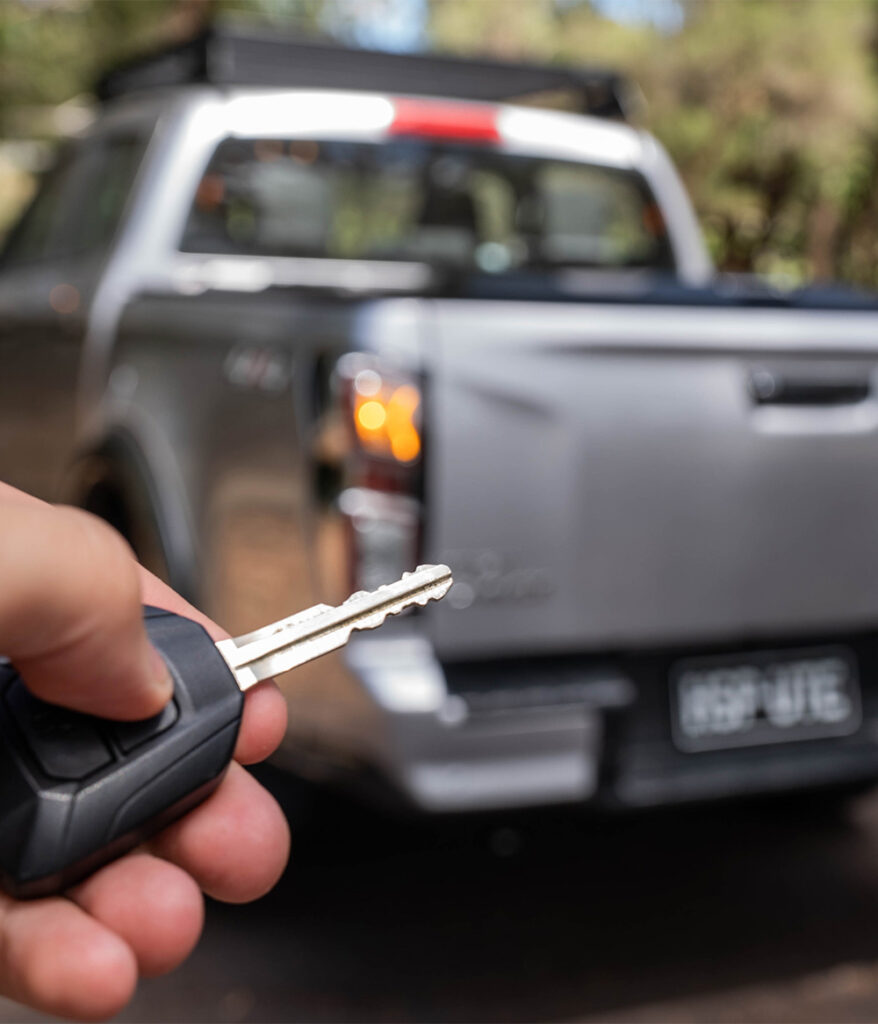 Person using tail lock on their ute
